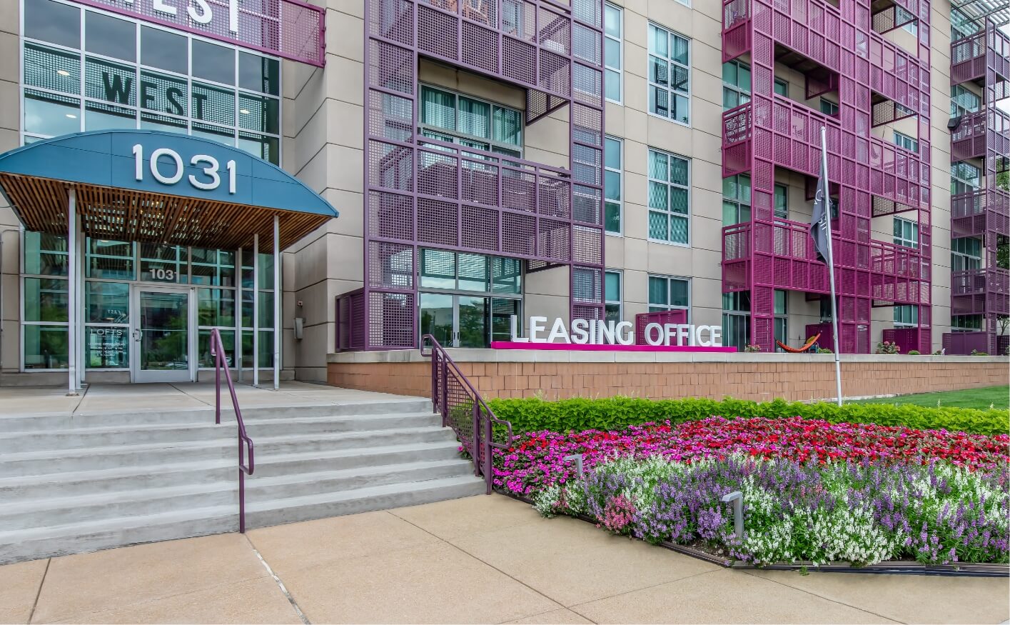 Exterior of leasing office with pink railings
